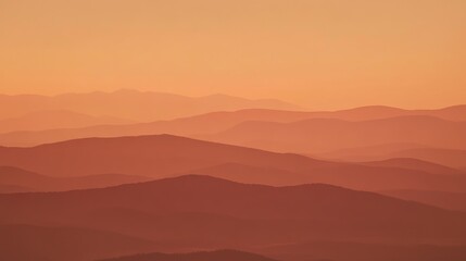 Fototapeta premium Sunset Hues Over Rolling Mountains: A Serene Landscape