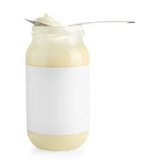 Tasty mayonnaise sauce in glass jar with blank label and spoon isolated on white