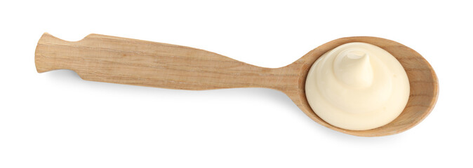 Tasty mayonnaise sauce in wooden spoon isolated on white, top view