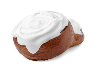 Tasty cinnamon rolls with cream isolated on white