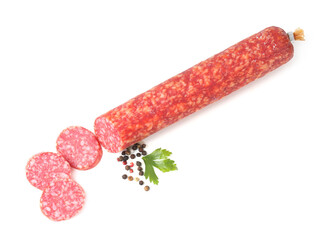 Delicious dry cured sausage and spices isolated on white, top view