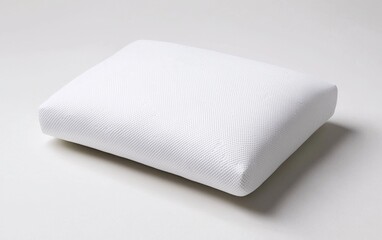 Fototapeta premium White pillow on a white background displaying minimalist and clean design aesthetic