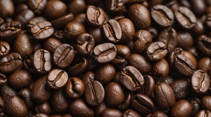 Fototapeta premium Richly roasted coffee beans in close-up showcasing texture and color variations highlighting their aromatic qualities.