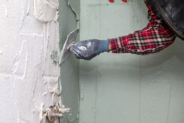 Construction Worker Plastering Wall – Renovation and Drywall Repair