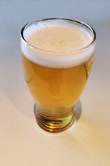 pint of lager beer on a pub table
