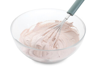 Bowl and whisk with delicious cream isolated on white