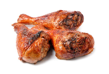 Delicious baked turkey drumsticks isolated on white