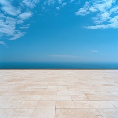 Fototapeta premium Peaceful Horizon: A high-quality shot of an empty marble floor extending into the distance, set against a vast blue sky with a few scattered clouds. 