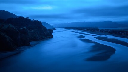 Fototapeta premium A serene landscape featuring a winding river at dusk, surrounded by dark cliffs and soft clouds, This image captures tranquility, ideal for nature articles, relaxation themes, or travel promotions,