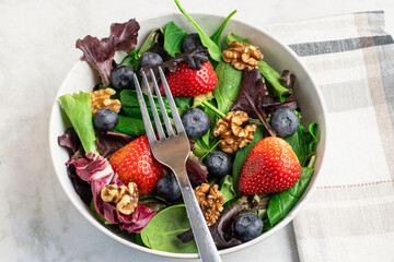 spring mix salad  with berries and nuts
