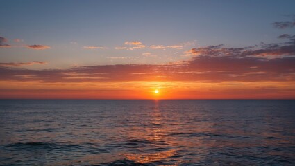 Obraz premium Serene Twilight Sunset Over Calm Ocean Water With Warm Colors And Clear Space For Text Overlay