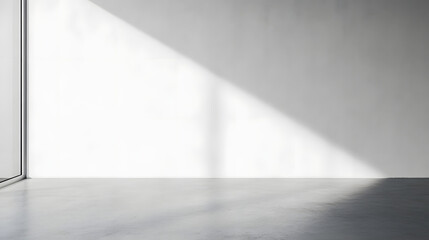 White empty room wall with soft light and copy space. Empty white wall background. Bright minimalistic empty abstract studio room with gray wall and concrete floor