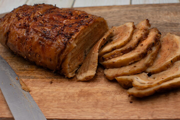 Seitan: vegan meat alternative made of washed flour gluten spices. Roasted and served on wooden board