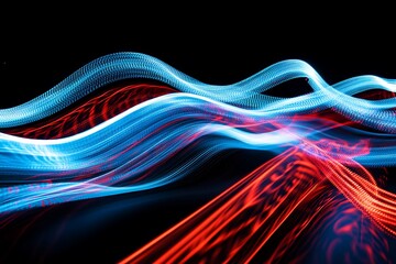 Photo visual is characterized by vibrant blue and red light trails that smoothly flow across a black backdrop, creating an abstract and energetic atmosphere.
