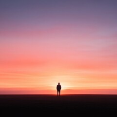 Silhouette of a Person Against Sunset Sky