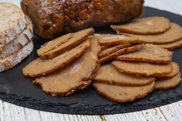 Vegan mock meat; made of wheat gluten; plant based. Steamed; roasted and sliced