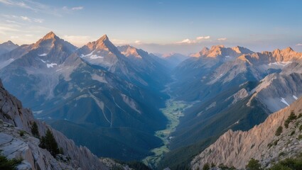 Obraz premium Stunning panoramic view of a mountain valley during sunset with dramatic peaks and clear sky, showcasing natural beauty and tranquility. Copy Space