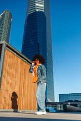 Fashionable woman with afro in urban setting
