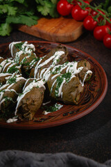 Traditional Stuffed Grape Leaves with Creamy Sauce and Fresh Herbs