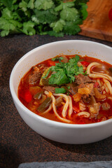Spicy Lagman Noodle Soup with Beef and Vegetables