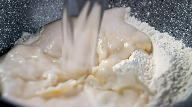 Adding water to flour