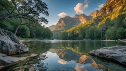 Fototapeta premium Mountain landscape with a river reflecting trees and clouds during golden hour with rock formations in the foreground Copy Space