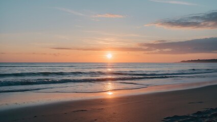 Fototapeta premium Coastal sunset over the ocean with gentle waves and colorful sky reflecting on the water surface Copy Space