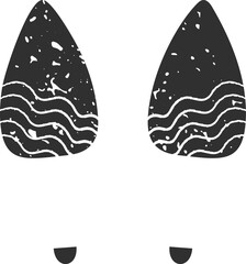 Two dark gray footprints featuring wavy lines and a grunge texture rest on a white background, forming a simple yet striking visual representation of a journey or adventure