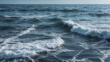 Fototapeta premium Waves crashing on the shoreline in a calm ocean landscape with rippling water under a clear sky featuring Copy Space
