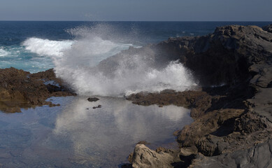 Gran Canaria, salt evaporation ponds Salinas el Bufadero around a blowhole Bufadero in the coast of Arucas municipality