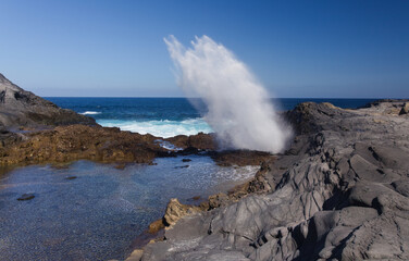 Gran Canaria, salt evaporation ponds Salinas el Bufadero around a blowhole Bufadero in the coast of Arucas municipality