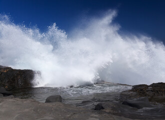 Gran Canaria, salt evaporation ponds Salinas el Bufadero around a blowhole Bufadero in the coast of Arucas municipality