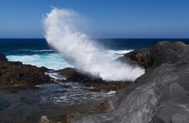 Gran Canaria, salt evaporation ponds Salinas el Bufadero around a blowhole Bufadero in the coast of Arucas municipality