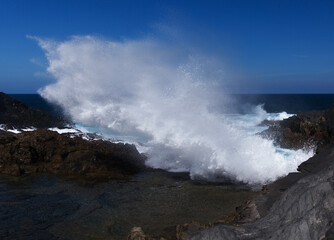 Gran Canaria, salt evaporation ponds Salinas el Bufadero around a blowhole Bufadero in the coast of Arucas municipality