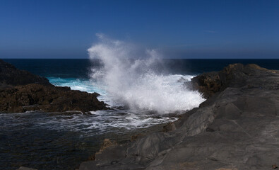 Gran Canaria, salt evaporation ponds Salinas el Bufadero around a blowhole Bufadero in the coast of Arucas municipality