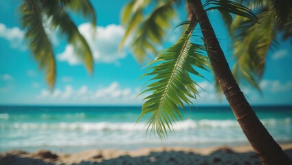 Fototapeta premium Tropical beach scene with palm leaves in foreground and blue ocean under sunny sky with clouds, Copy Space