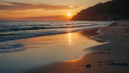 Obraz premium Sunset over calm ocean waves reflecting on sandy beach with gentle shore and distant cliffs during twilight golden hour. Copy Space