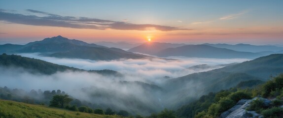 Mountainous landscape at sunrise with fog covering valleys and peaks in soft morning light Copy Space