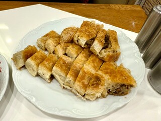 Turkish style meat stuffed filo dough borek served kol boregi.