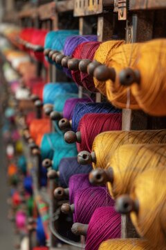 Colorful Threads and Spinning Machines in Eco-Friendly Textile Production
