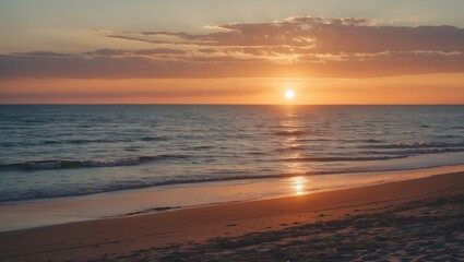 Sunset over calm ocean waves with sandy beach shoreline and colorful sky in warm tones, tranquil nature landscape, Copy Space