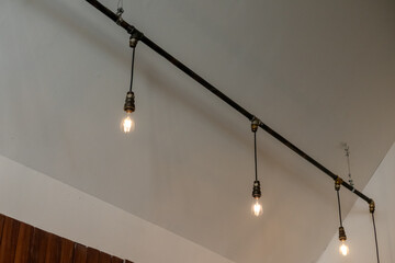 Hanging Edison light bulb on the ceiling, also known as filament light bulb