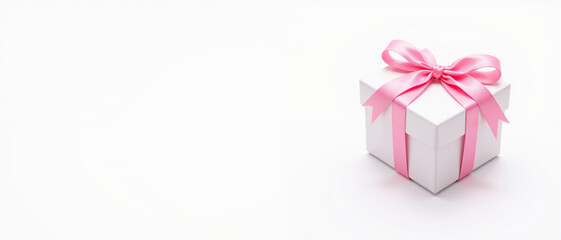 Fototapeta premium White gift box adorned with a pink ribbon exuding a celebratory and joyful mood symbolizing thoughtful gifting against a minimalistic white background