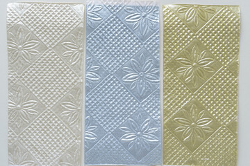 set of embossed decorative paper sheets with floral motif and textured patterns