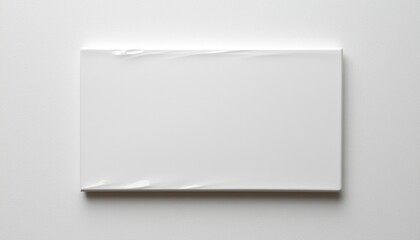 Fototapeta premium Blank wrapped canvas lies ready for artwork, indoors, for presentation purposes