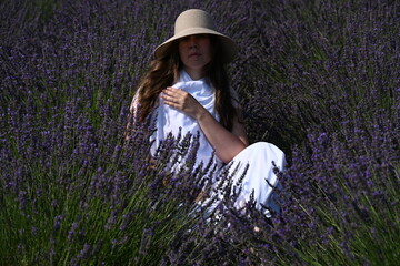 girl in white dress on lavender field,
