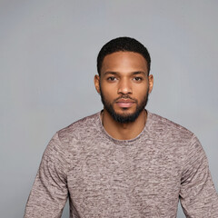 Obraz premium Portrait of serious African American man in casual wear looking directly at camera with calm and confident expression