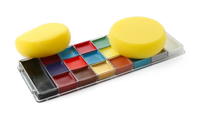 Bright face paint palette and sponges isolated on white