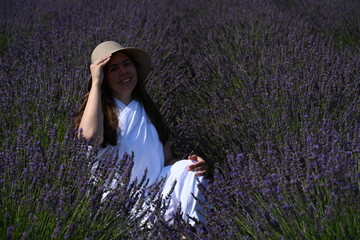 girl in white dress on lavender field,