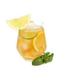 Refreshing iced tea with slices of lemon, lime and mint isolated on white